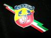 "Abarth & C." painted emblem with tricolor lightning bolt.