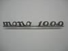 Scritta cromata "Monomille" con barretta. Lungh: 185mm.