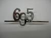 Medium "695" chromed logo with bar. Length: 87mm.
