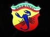 "Abarth & C." emblem on horizontal tricolor backing. "Stylized" scorpion. Enamel h: 70mm. 1966&rarr;